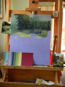 painting on easel with selected color paper swatches